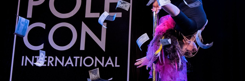 Pole Dancer Inverts As Money Flies Through The Air.