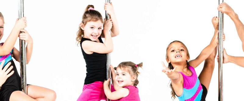Smiling Children Climbing Poles And Waving.