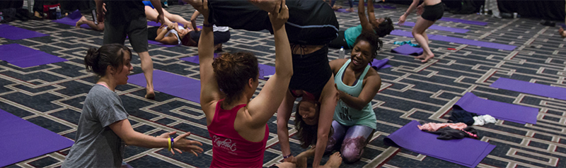 Spotting A Student During An Acro Workshop.