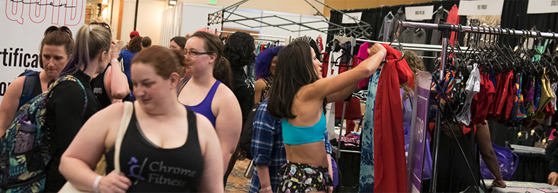 Shoppers At An Apparel Booth At PoleCon.