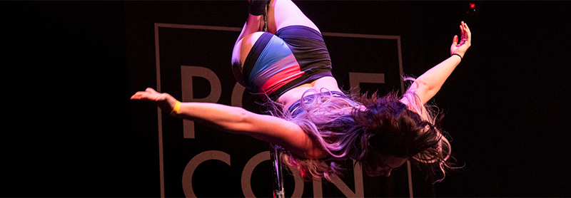 Pole Dancer Inverted On Stage.