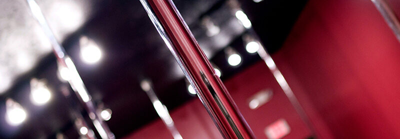 Close Up Image Of Poles In A Pole Dance Studio Setting.