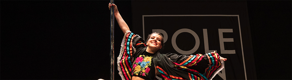 Catrina performs at PoleCon 2023 in the inaugural Latin Heritage showcase.