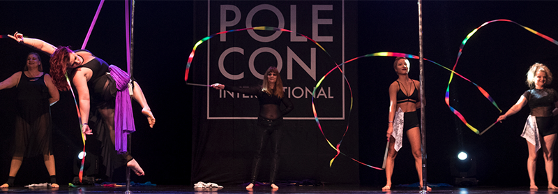 Head Over Heels Troupe Performs At PoleCon 2021.