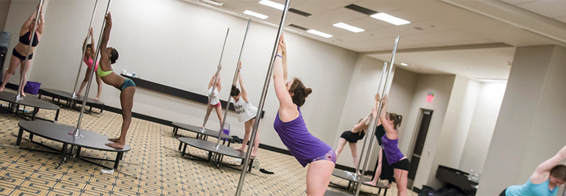 Pole Class, Students Doing A Warm Up.