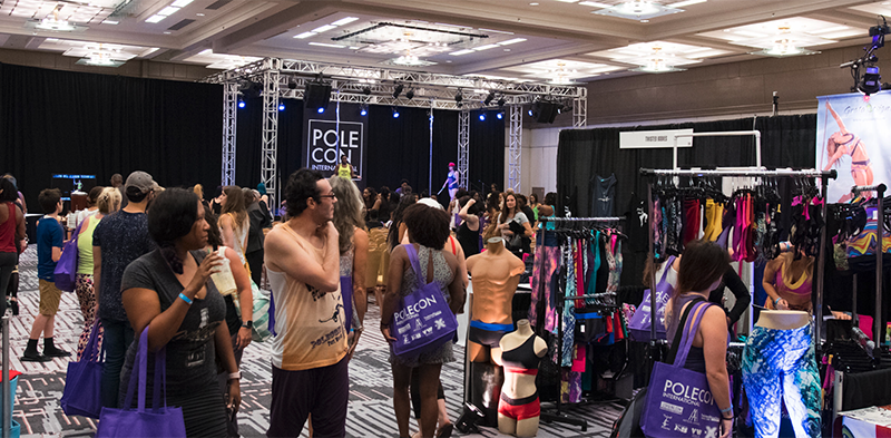 Image of PoleCon vendor floor and stage area from 2017 event.