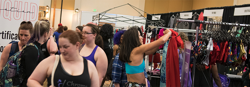 Shoppers in the vendor area of PoleCon 2019