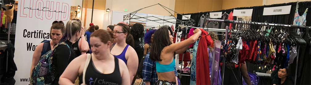 Shoppers in the vendor area of PoleCon 2019