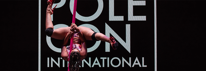 Pink Quartz performs on a flying pole at PoleCon 2024
